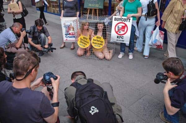 PETA Traps Semi-Nude Women in Cages for Publicity Stunt